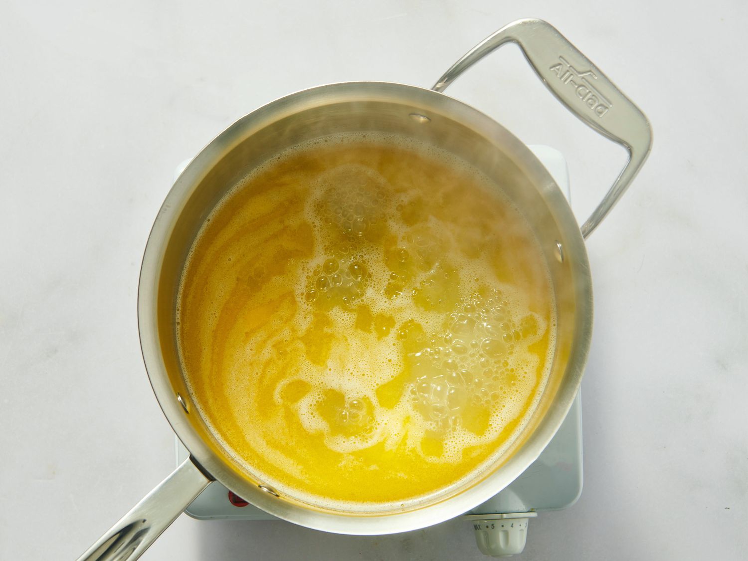 Melting butter in a saucepan.