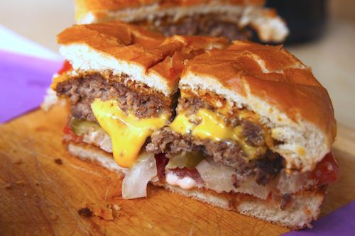 A halved In-n-Out Double-Double, ready for tasting.