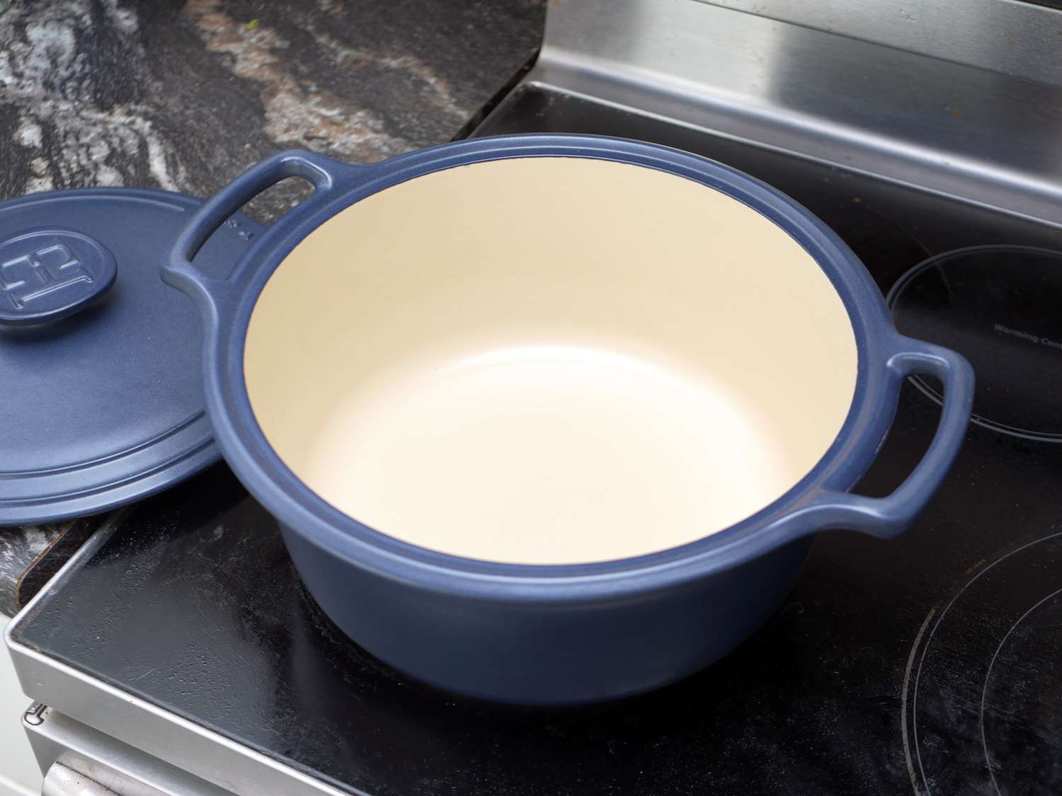 the interior of the emile henry dutch oven showcasing it's pale ceramic