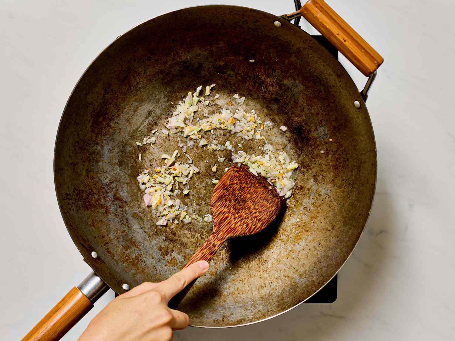 Cooking aromatics in a wok.