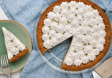 Vegan Key lime pie with one slice removed (slice is alongside on a plate)