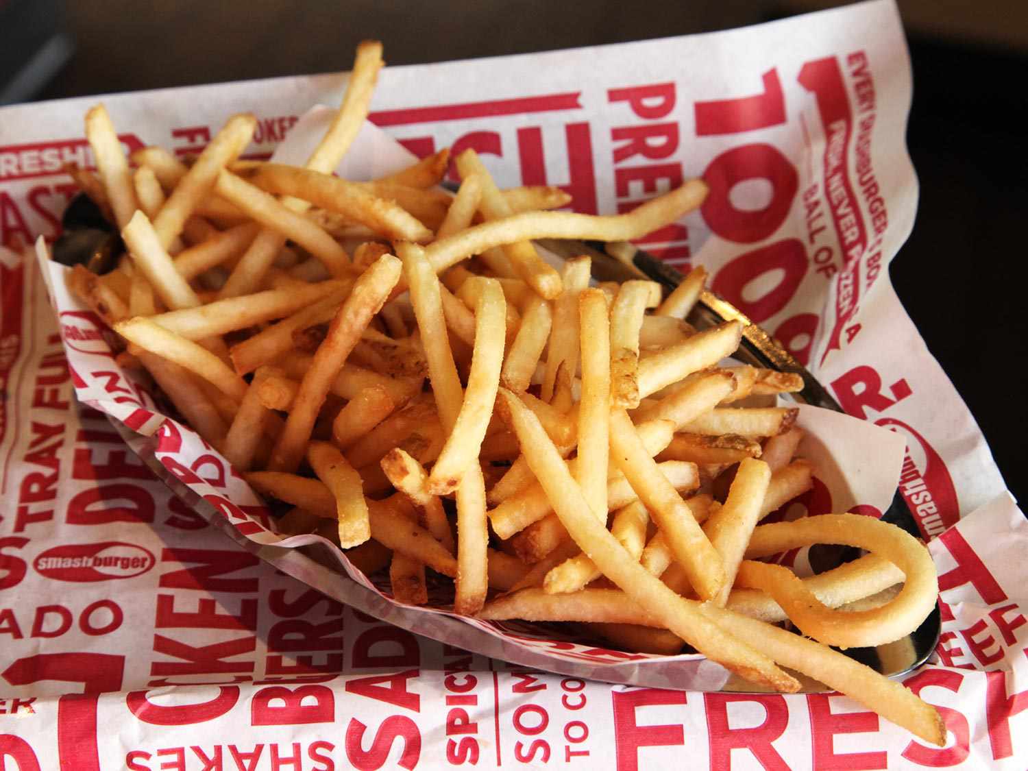 A container of shoestring fries from Smashburger