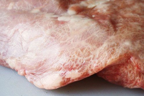 A close up of an uncooked sweetbread.