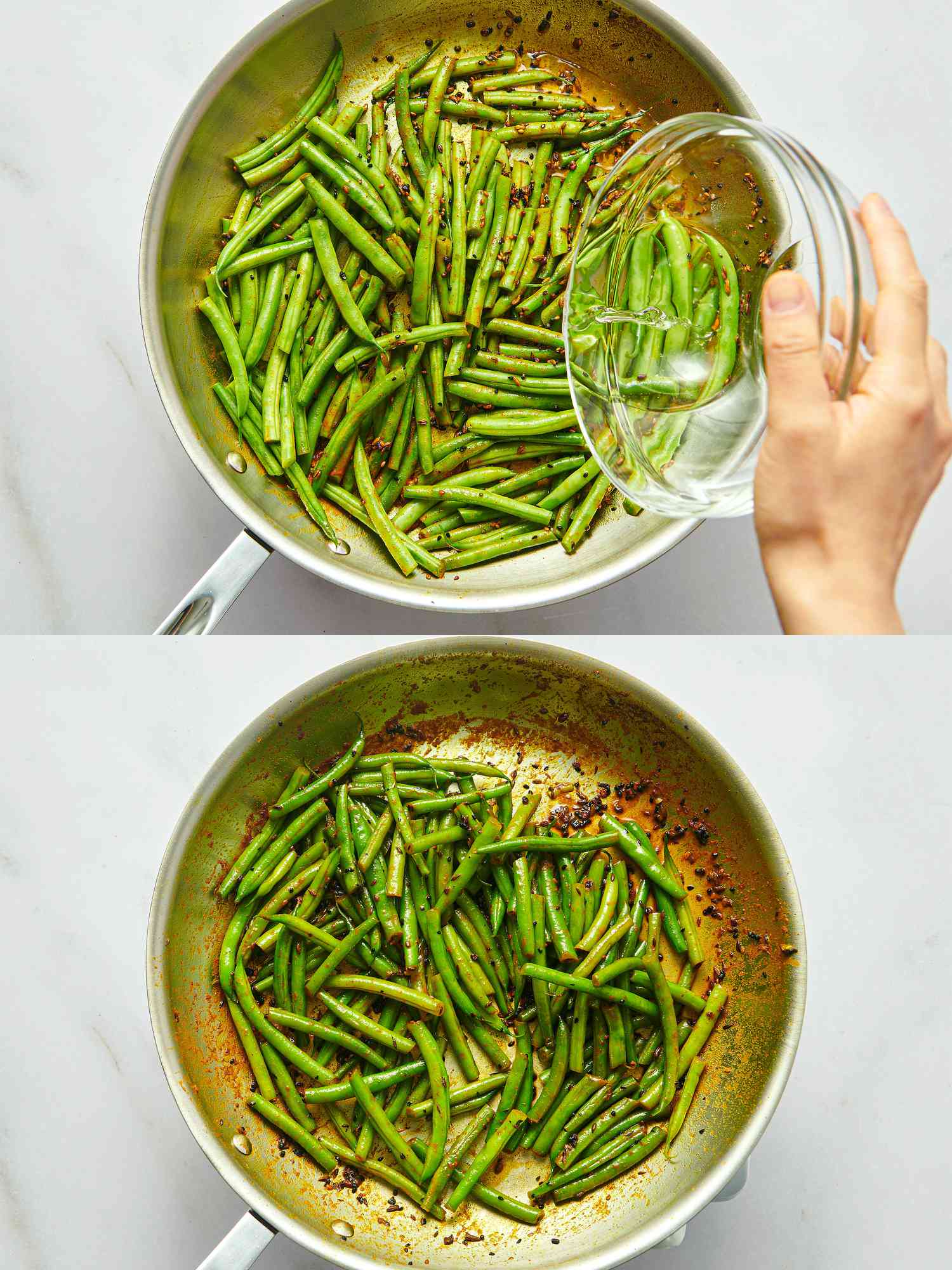 Green beans being sautéed in a pan, with water being added and spices visible