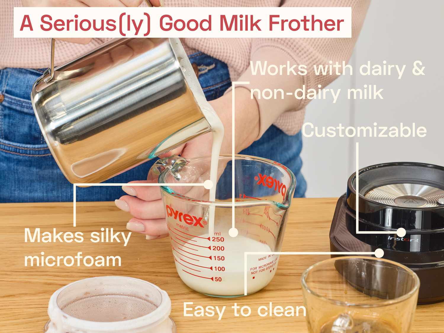 a person using the instant milk frother to pour frothy milk into a liquid measuring cup