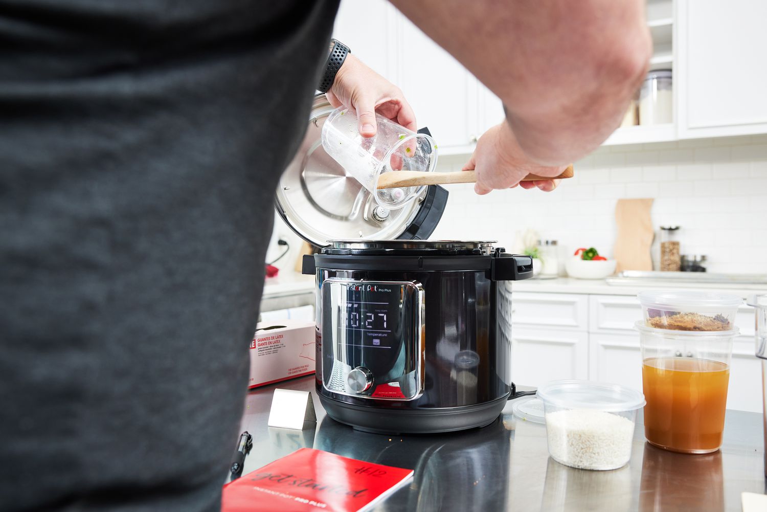 Person pouring ingredients into the Instant Pot Pro Plus Wi-Fi Smart 10-in-1 6 Quart Pressure Cooker