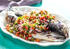 Platter of two whole grilled fish with Brazilian pico de gallo