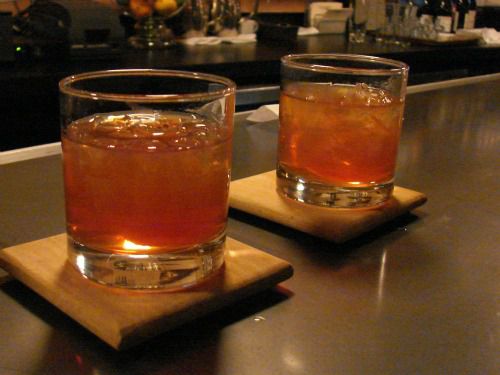 Two old fashioned cocktails in rocks glasses. 