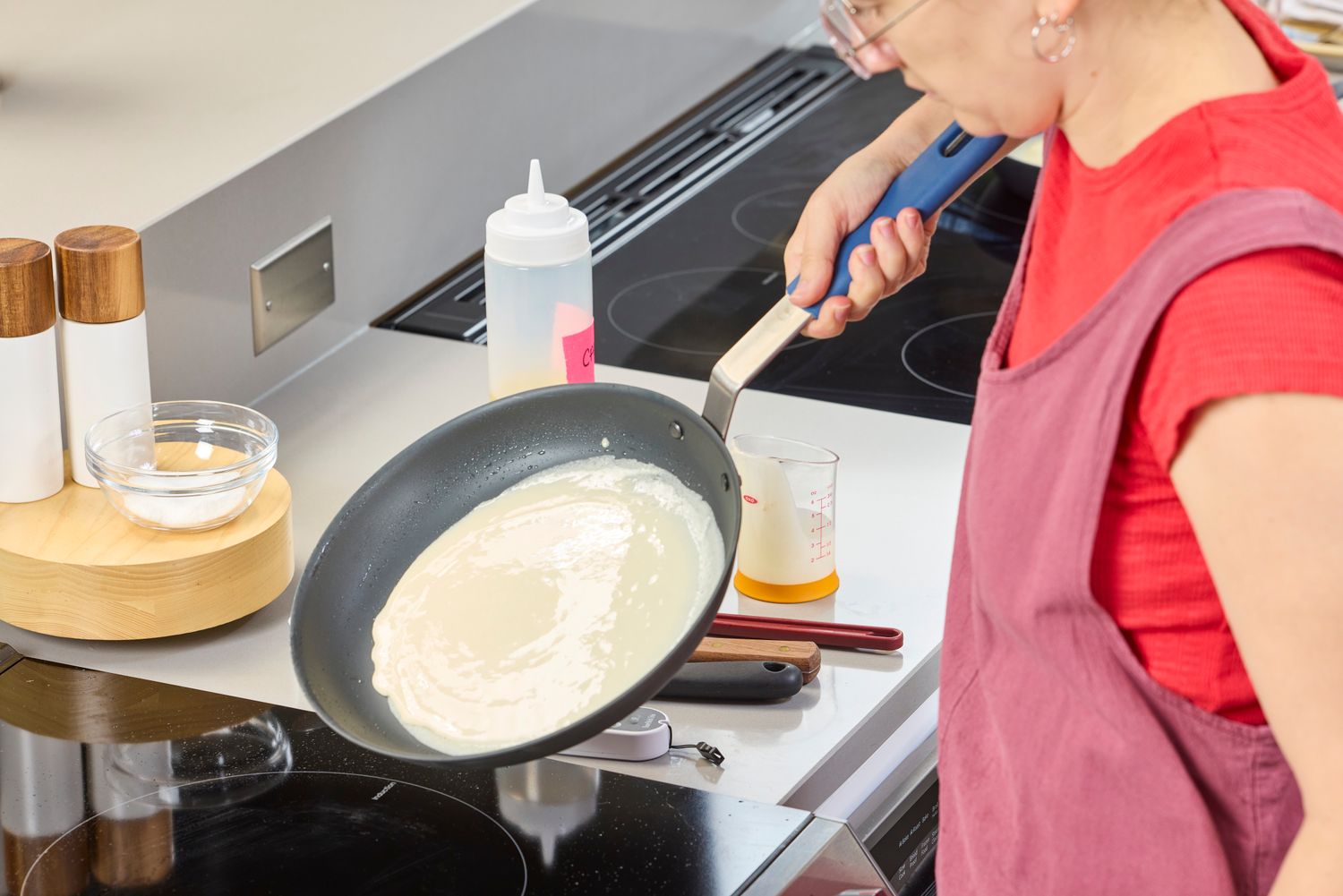 A person cooks crepes in the Misen Pre-Seasoned 10 Inch Carbon Steel Pan