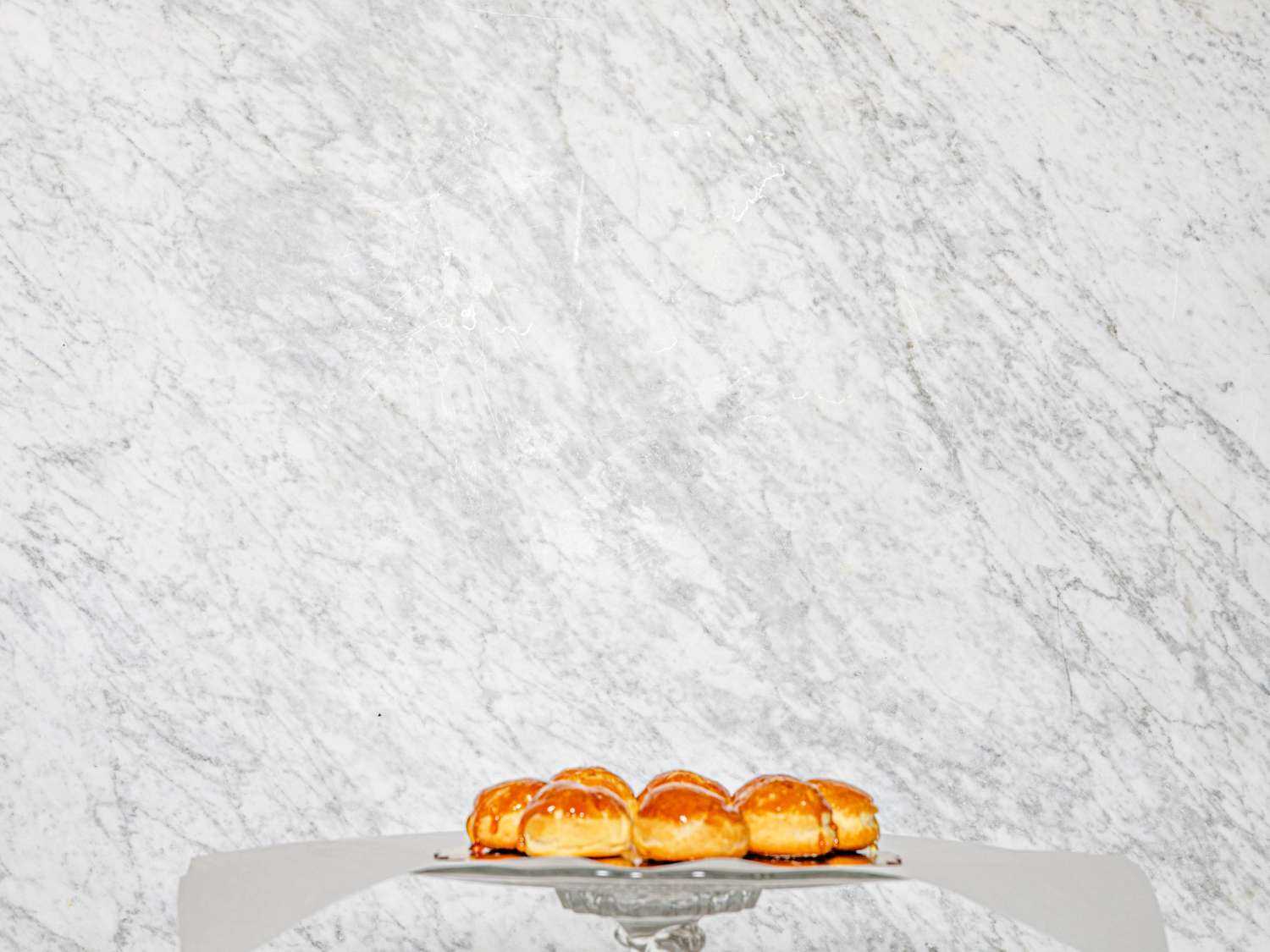 First layer of croquembouche placed on parchment 