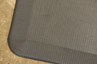 A close-up of the corner on the ComfiLife Anti-Fatigue Floor Mat