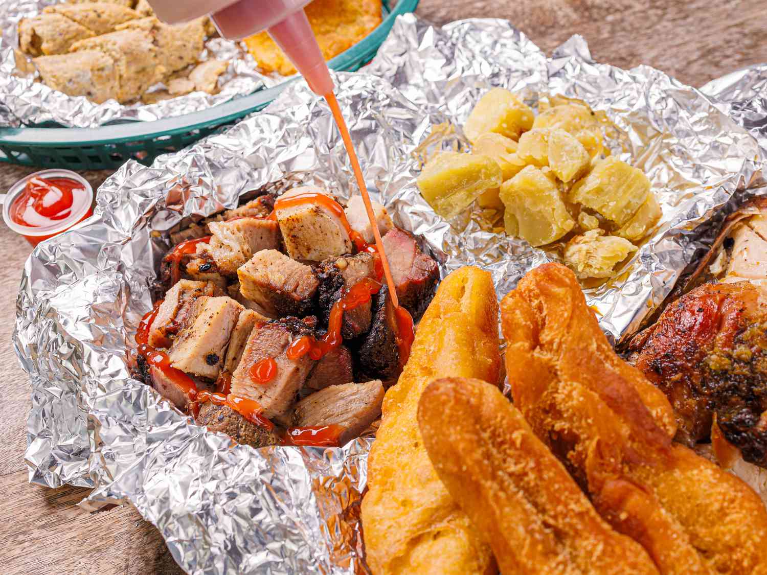 Jerk Pork being dressed with ketchup 