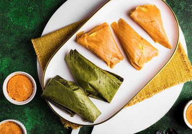 Overhead view of moin moin, unwrapped and wrapped, and in ramekins