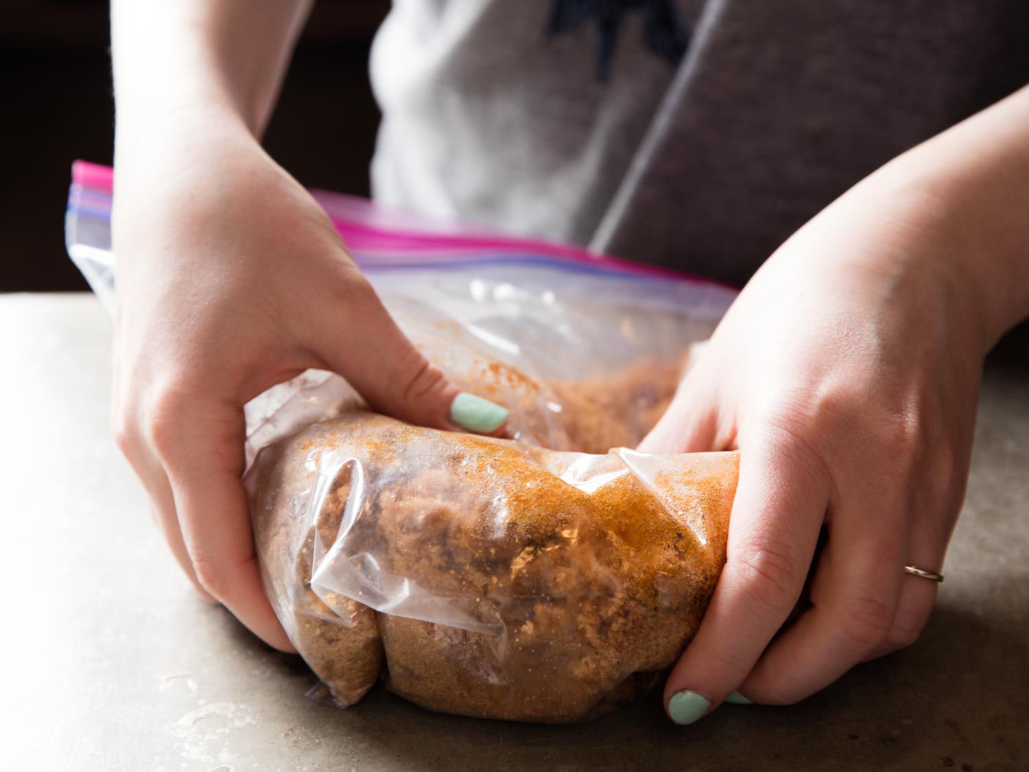 The moistened and heated brown sugar is massaged to rehydrate.