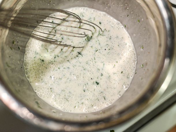 Whisking the jalapeno lime dressing for coleslaw.