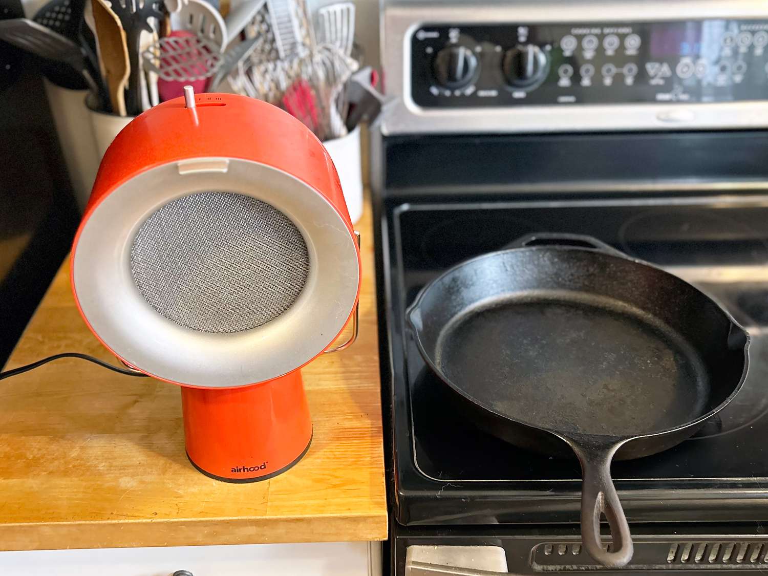 the airhood next to a cast iron skillet 
