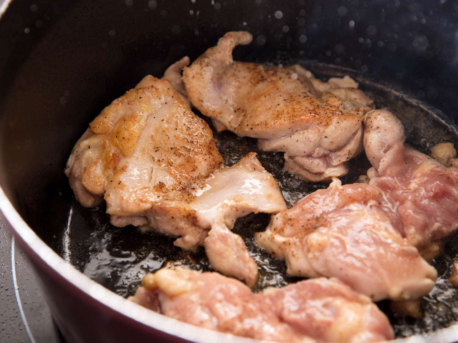 Searing boneless chicken thighs in a Dutch oven for Japanese curry rice.