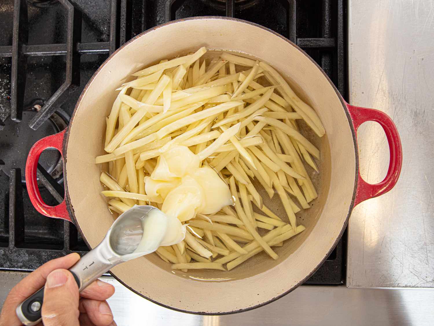 Overhead view of frying potatoes