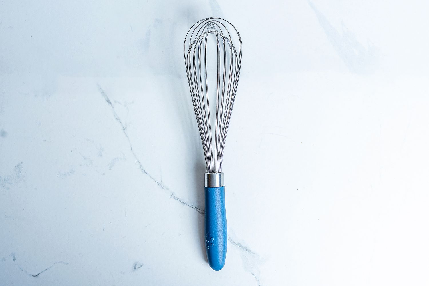 Misen Stainless Steel Whisk on a marbled surface