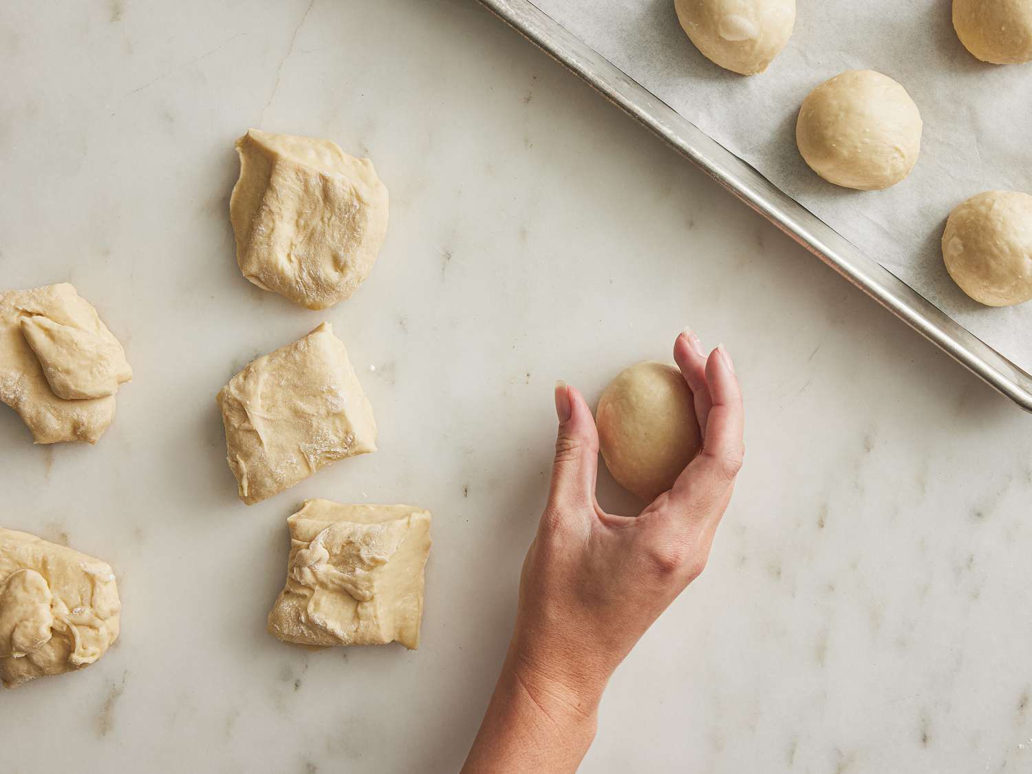 Rolling dough into variety of balls 