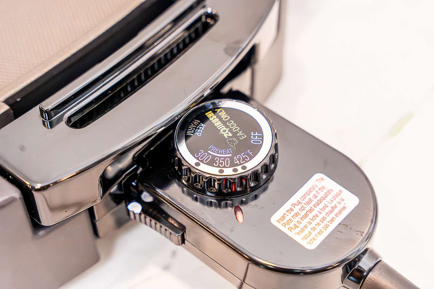 A closeup on the temperature knob of the Zojirushi electric griddle