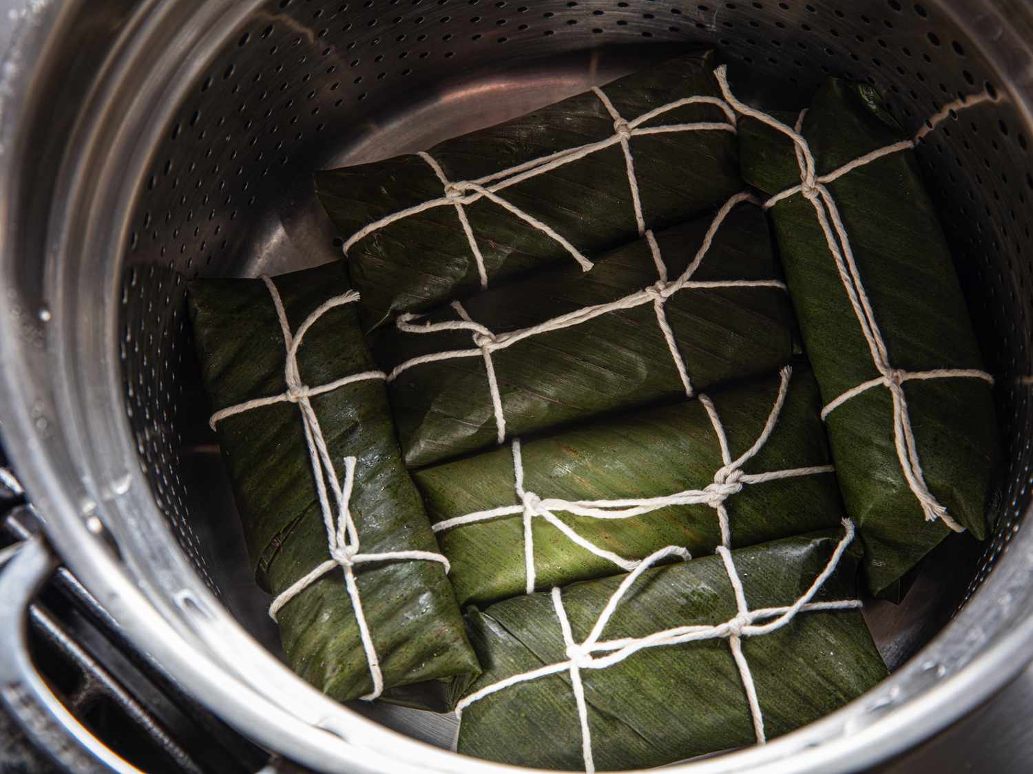 Overhead view of wrapped suman in steamer