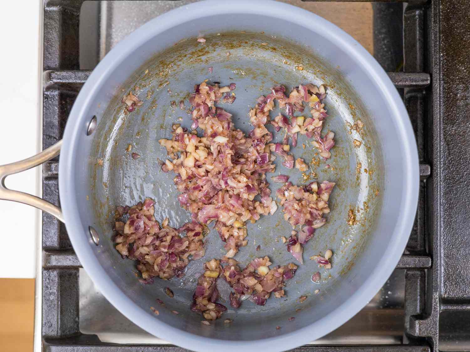 Garlic and onion frying in a saucepan