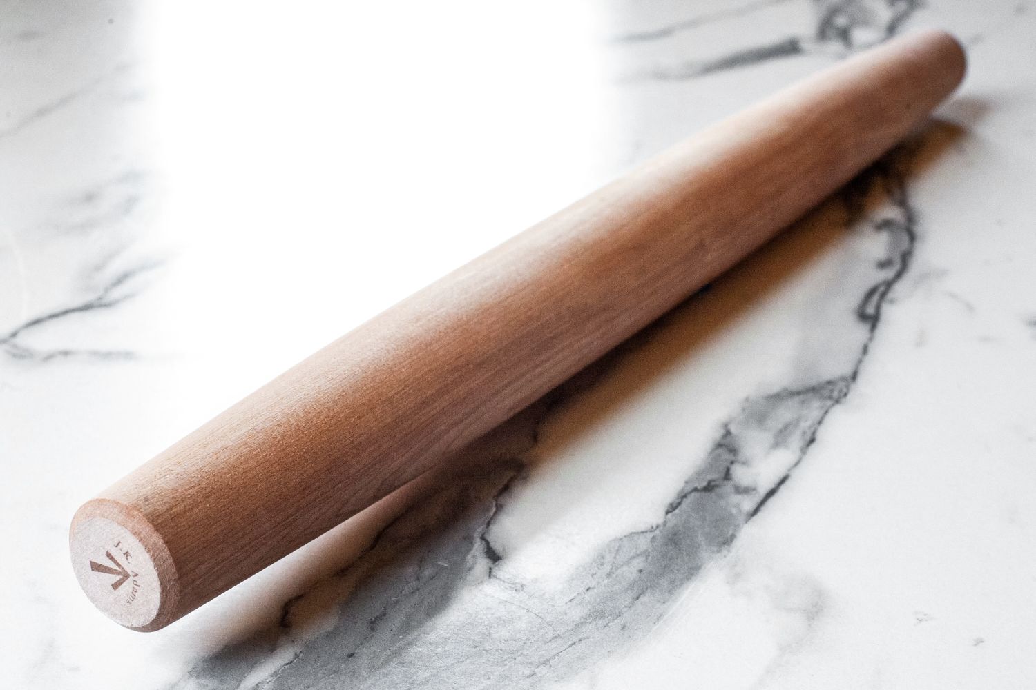 J.K. Adams Maple French Rolling Pin on a marble surface