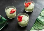 Fresh basil mousse, served in shallow drinking glasses and garnished with sliced strawberry.