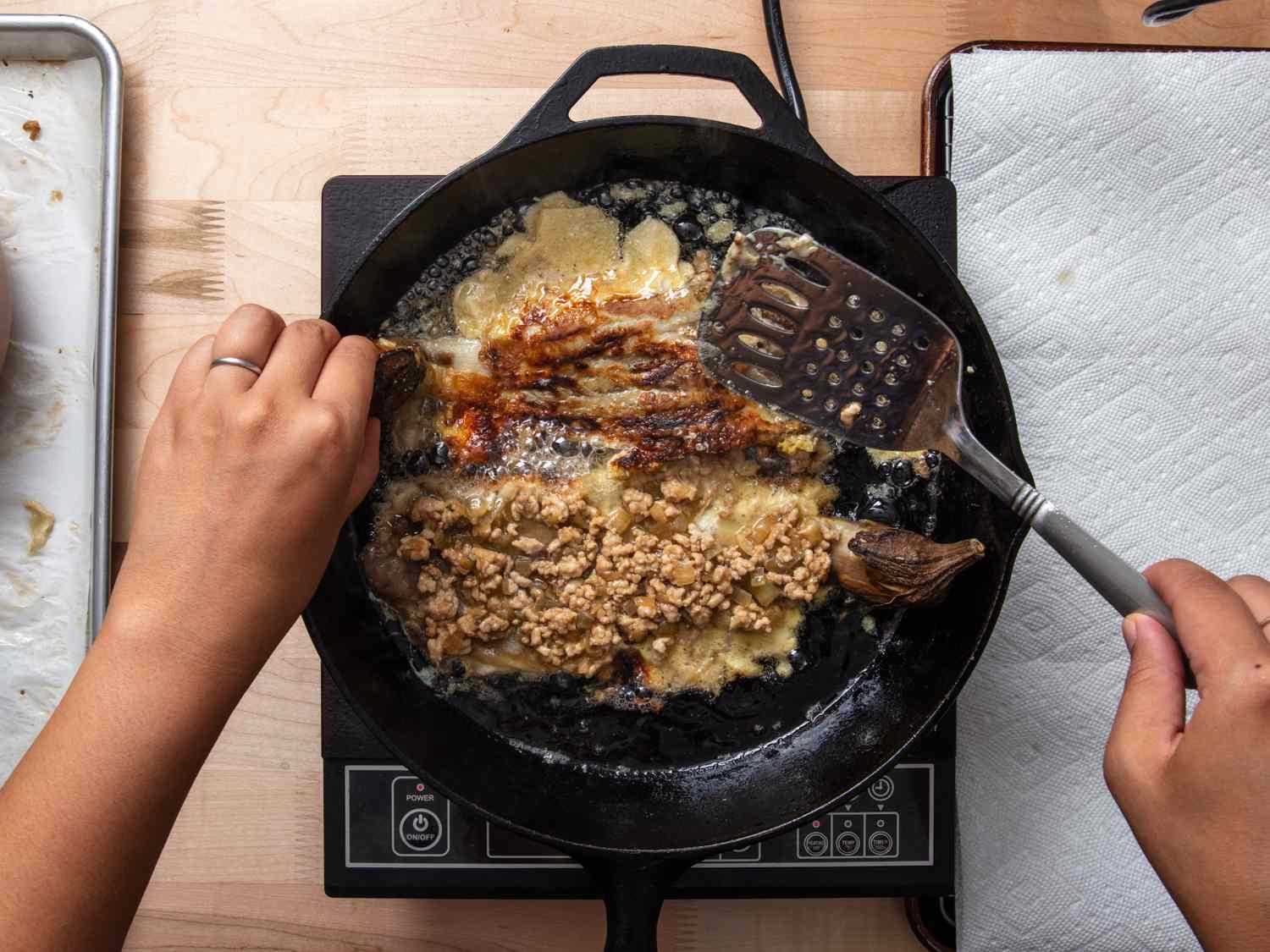 tortang talong cooking in cast iron skillet