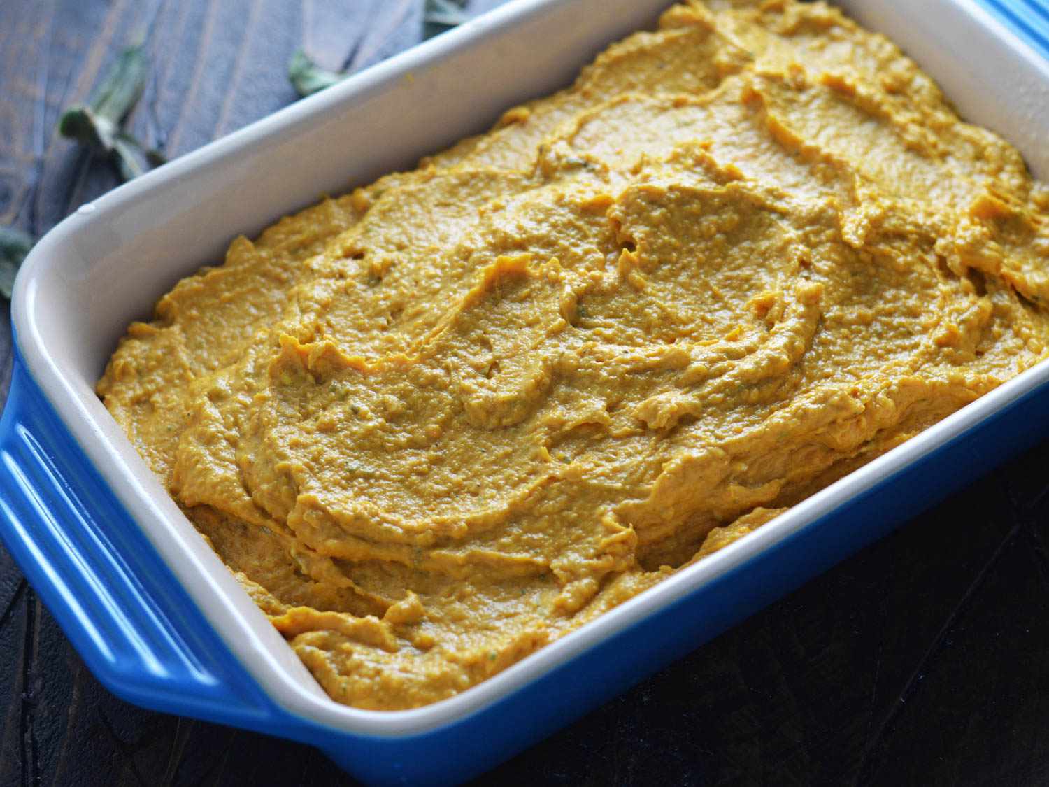 Butternut squash and cheddar dip in a baking dish about to go into the oven. 