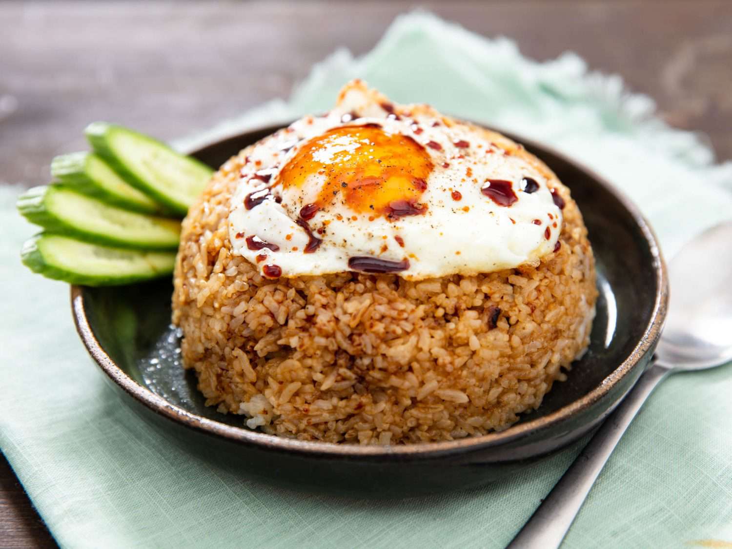 Nasi goreng on plate, topped with a fried egg