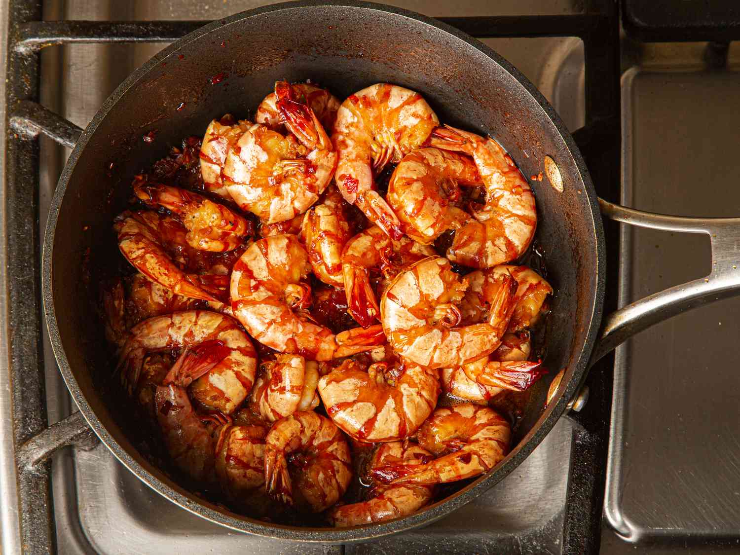 Overhead view of shrimp cooked in marinade 