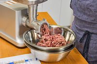 Close-up meat grinding in Weston #12 Electric Meat Grinder & Sausage Stuffer