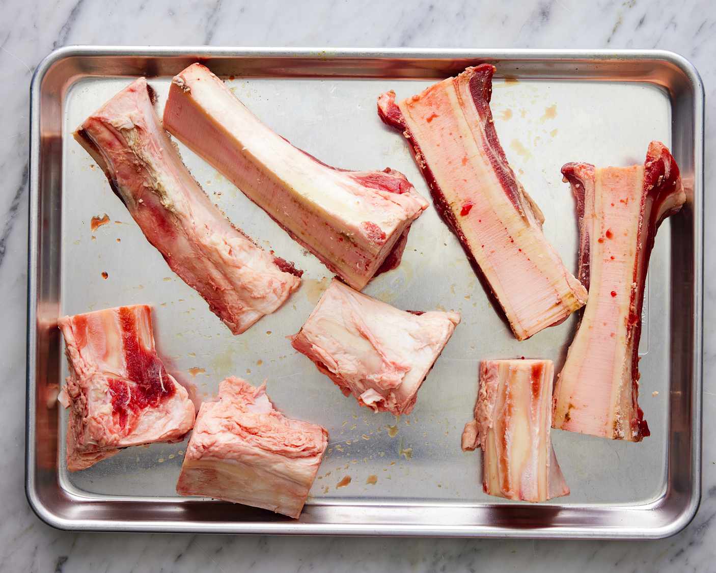 Overhead view of bones on a baking tray