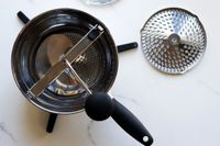 The oxo food mill on a marble surface