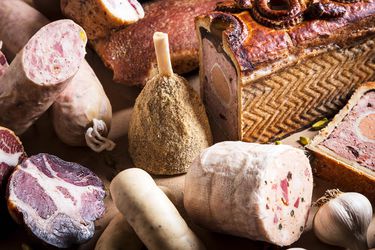 A selection of the charcuterie Shapiro produces. At center is a mini ham. Clockwise from the right: pâté en croûte, chicken galantine, saucisson à l'ail, capocollo, pancetta, guanciale.