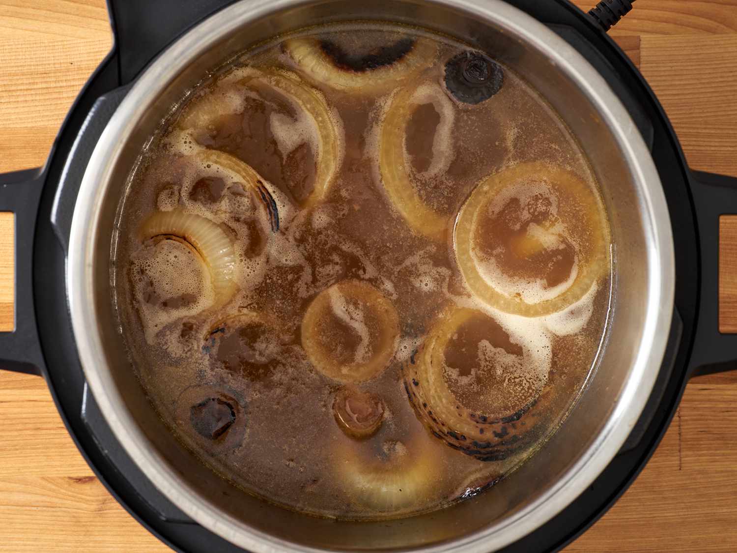 Charred onions in broth.
