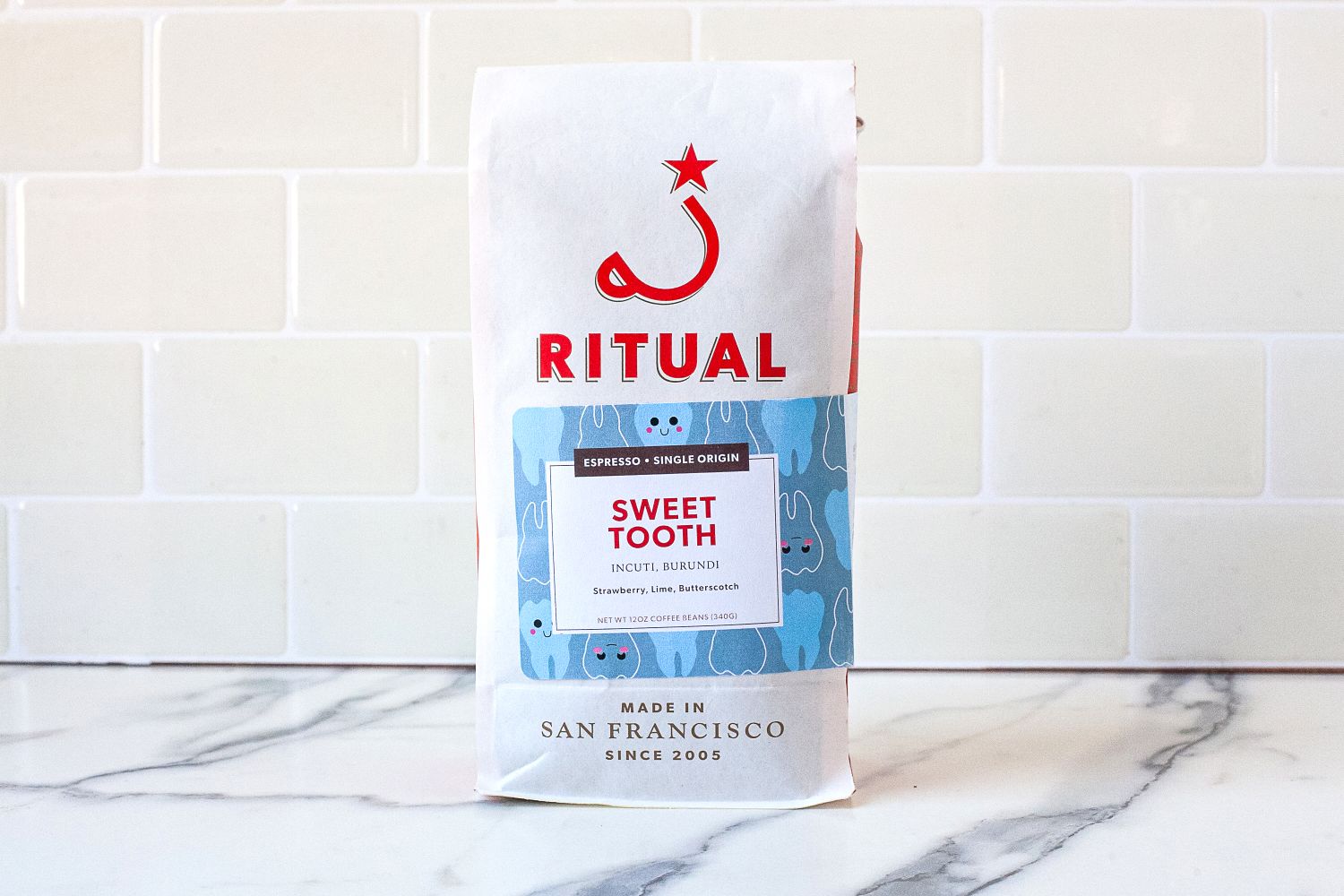 A bag of Ritual coffee labeled 'Sweet Tooth' on a tiled surface