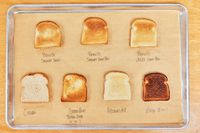 Toasts made in different toaster ovens including the Breville the Smart Oven Air Fryer on a tray