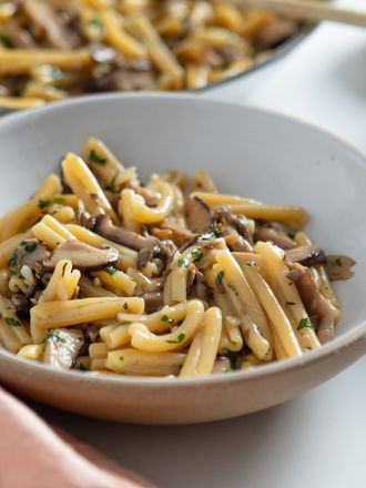 two servings of pasta ai funghi in Jono Pandolfi ceramic bowls