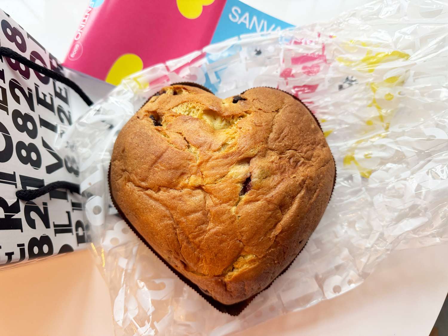 A heart-shaped pannettone loaf of bread on a table