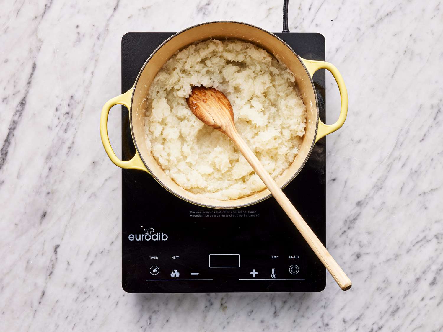 Overhead view of cooking daikon in pot 