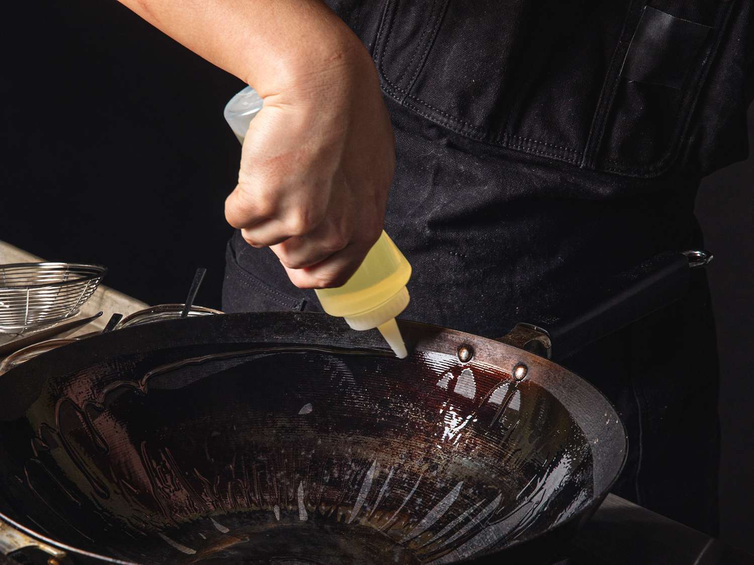 Oil being put into a wok.