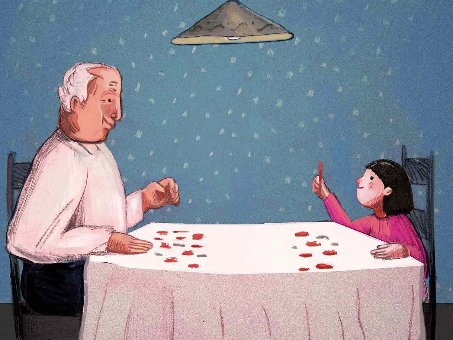 An elderly man and a child sitting at a table with small items interacting