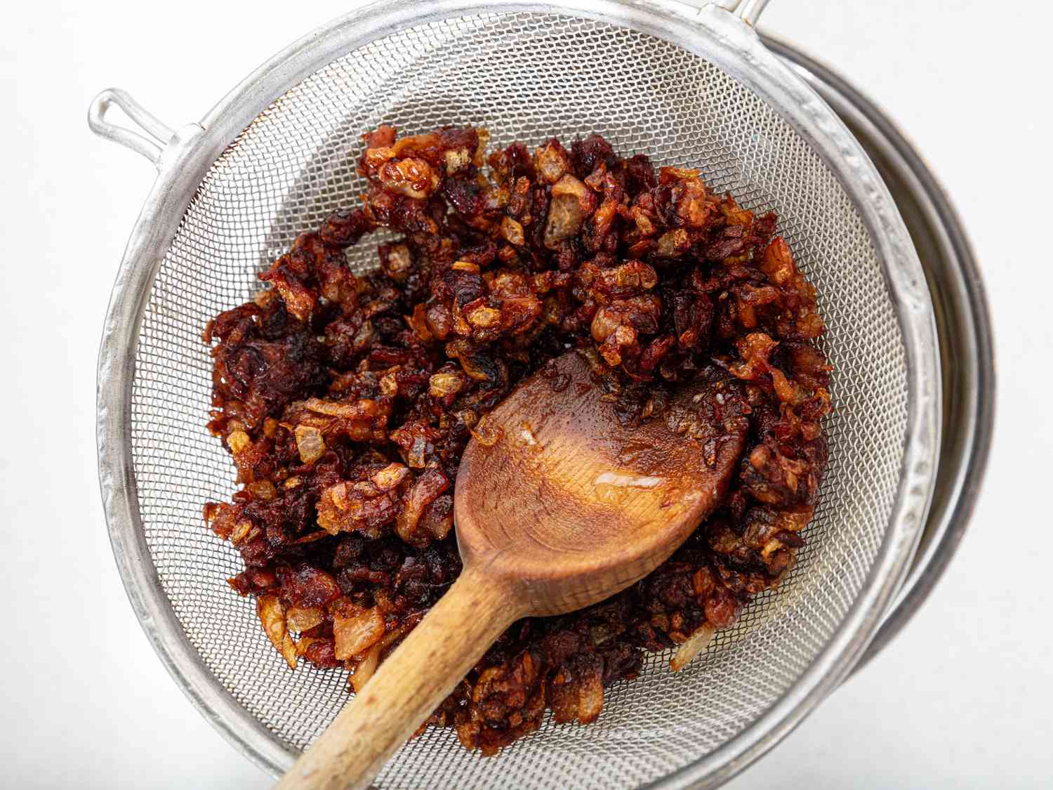 Gribines and schmaltz poured over a fine mesh sieve 