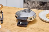 Steam is emitted from the Cuisinart WMR-CANAS Round Classic Waffle Maker