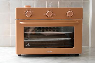 The Our Place Large Wonder Oven on a gray kitchen counter