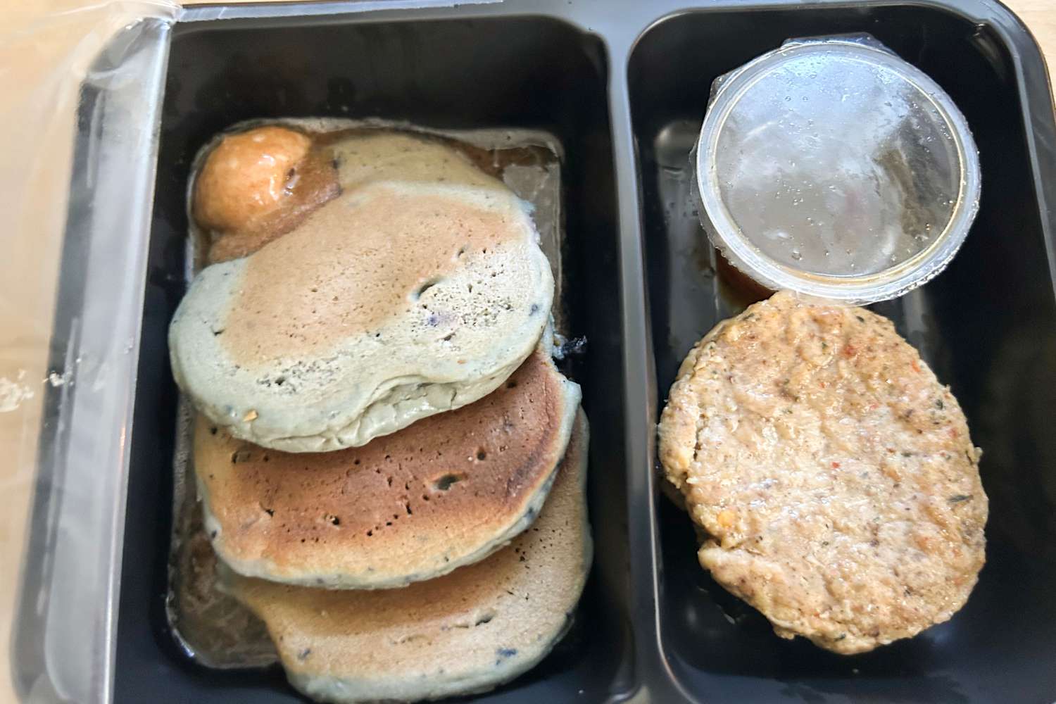 A Factor meal on a wood surface