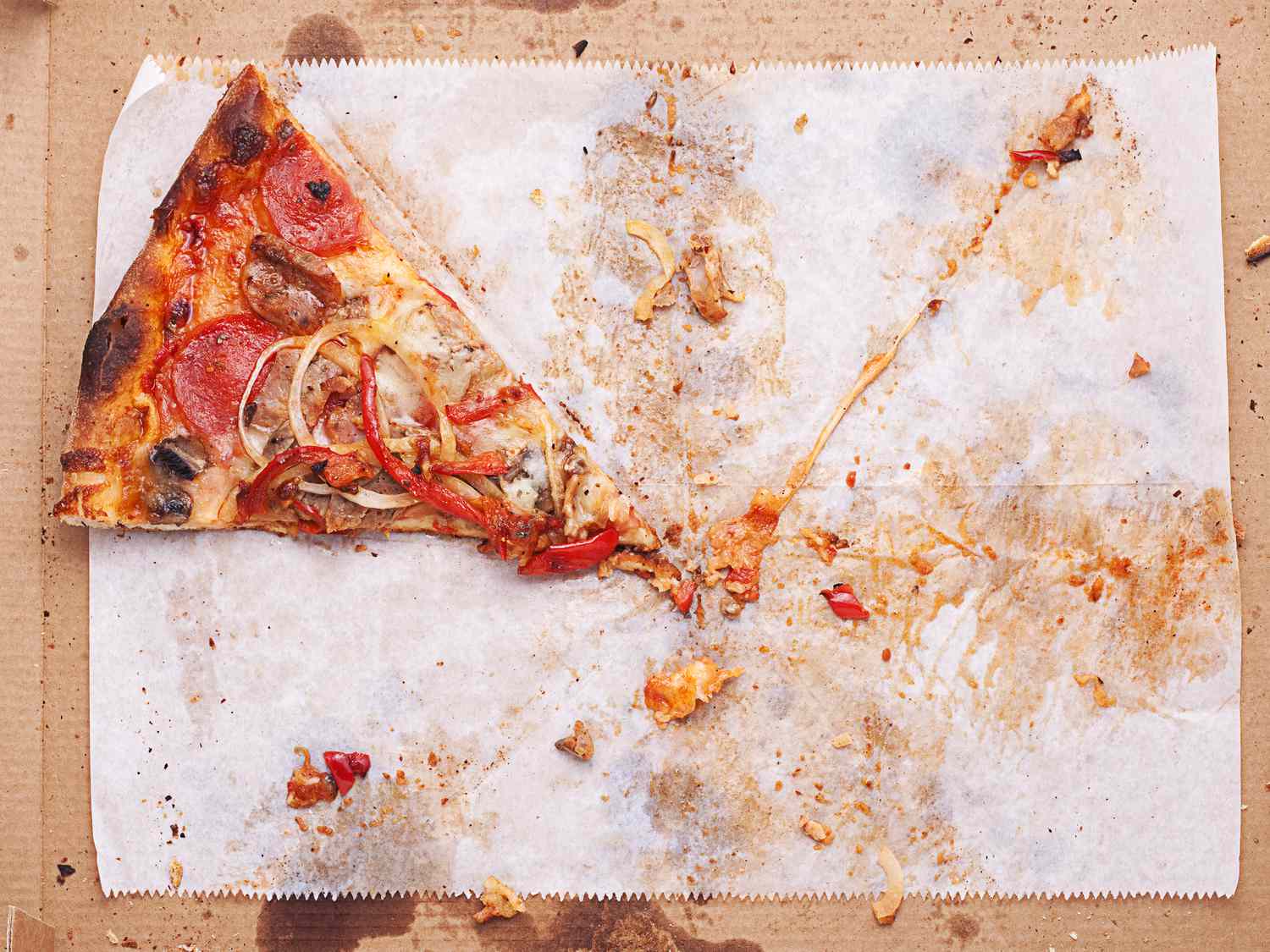 Overhead view of last slice of pizza